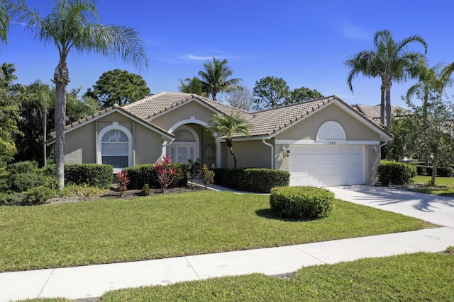 single story home with stucco siding, a front lawn, concrete driveway, a garage, and a tiled roof