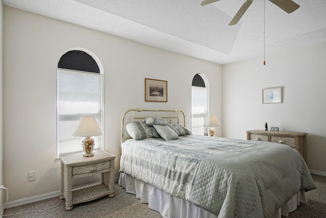 bedroom with multiple windows, carpet floors, baseboards, and a ceiling fan