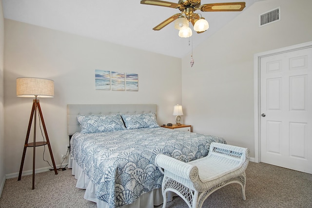 carpeted bedroom featuring lofted ceiling, baseboards, visible vents, and ceiling fan