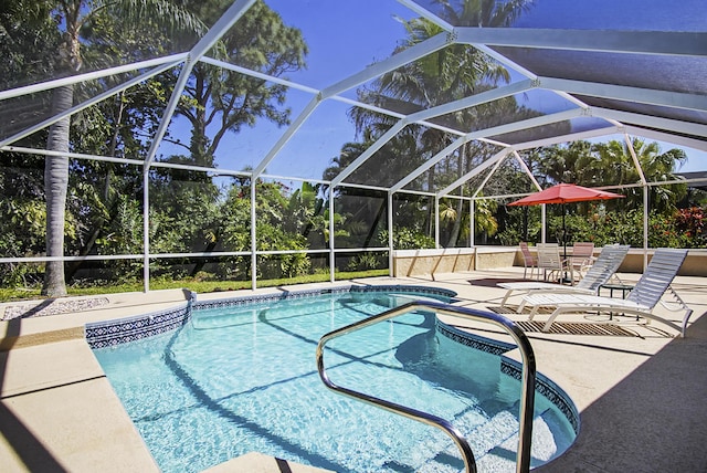 pool with a patio area and glass enclosure