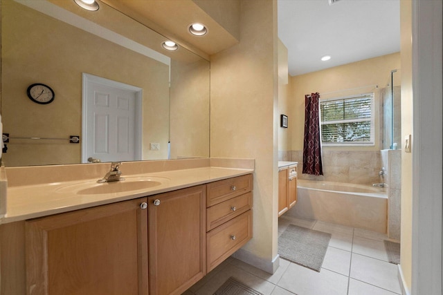 bathroom with recessed lighting, a bath, vanity, and tile patterned flooring