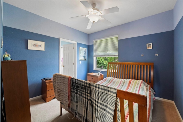 bedroom with baseboards, carpet floors, and a ceiling fan