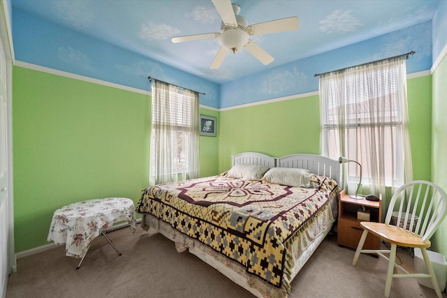 carpeted bedroom with a ceiling fan