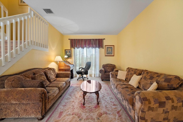 carpeted living area with visible vents