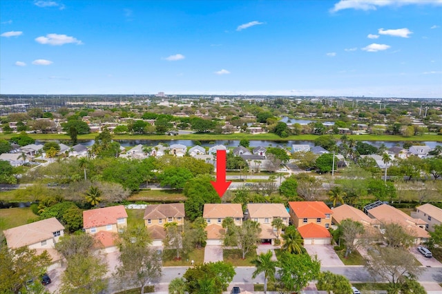 bird's eye view featuring a residential view and a water view