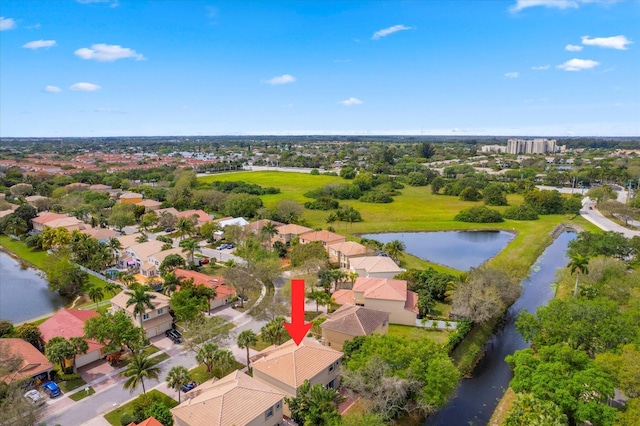 birds eye view of property with a residential view and a water view