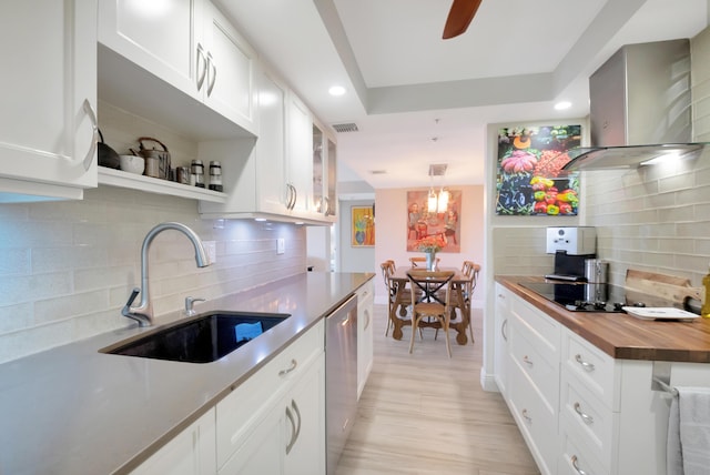 1523 Bridgewood Dr, Boca Raton, FL 33434 - kitchen with black electric cooktop, dishwasher, wooden counters, wall chimney exhaust hood, and a sink