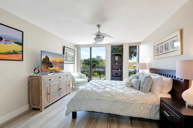 1523 Bridgewood Dr, Boca Raton, FL 33434 - bedroom with expansive windows, light wood-style flooring, baseboards, and a ceiling fan