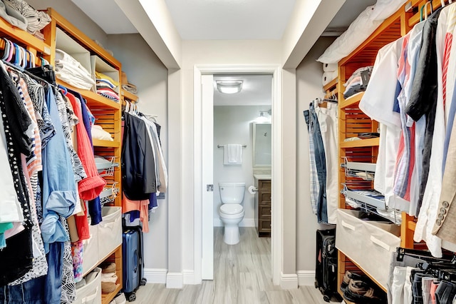 1523 Bridgewood Dr, Boca Raton, FL 33434 - walk in closet featuring wood finished floors