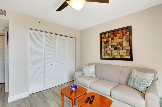 1523 Bridgewood Dr, Boca Raton, FL 33434 - living area with light wood finished floors, baseboards, visible vents, and a ceiling fan