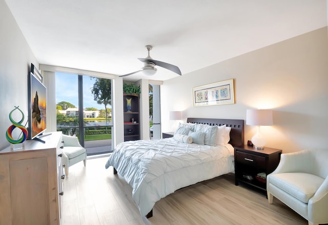 1523 Bridgewood Dr, Boca Raton, FL 33434 - bedroom with expansive windows, access to exterior, light wood-style floors, and ceiling fan