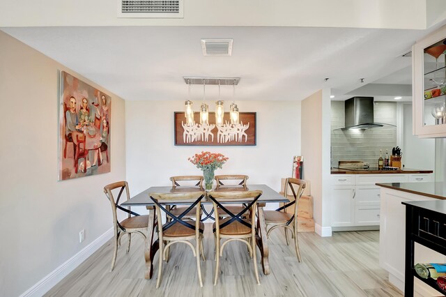 1523 Bridgewood Dr, Boca Raton, FL 33434 - dining room featuring baseboards, visible vents, light wood-style flooring, and an inviting chandelier