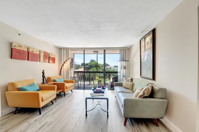 1523 Bridgewood Dr, Boca Raton, FL 33434 - living area with expansive windows, wood finished floors, and baseboards