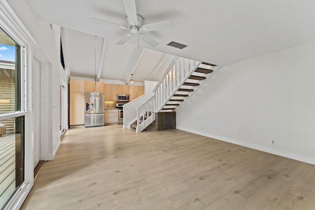 unfurnished living room with stairway, light wood-style flooring, a ceiling fan, and visible vents