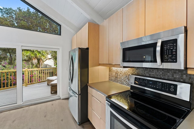 kitchen with vaulted ceiling with beams, tasteful backsplash, light brown cabinetry, and stainless steel appliances