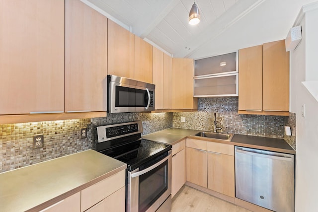 kitchen with light brown cabinetry, a sink, open shelves, stainless steel appliances, and vaulted ceiling with beams