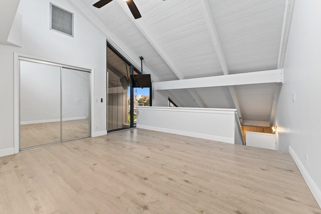 bonus room featuring wood finished floors, baseboards, visible vents, vaulted ceiling with beams, and ceiling fan