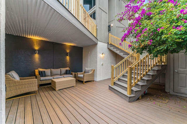 wooden terrace featuring an outdoor hangout area and stairs