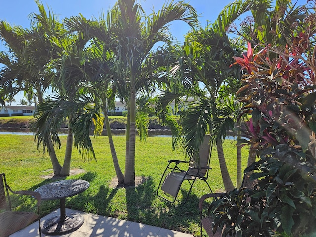 exterior space featuring a yard and a water view