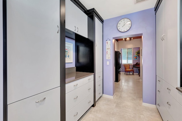 110 Dolphin Rd, Ocean Ridge, FL 33435 - corridor with light tile patterned floors and baseboards