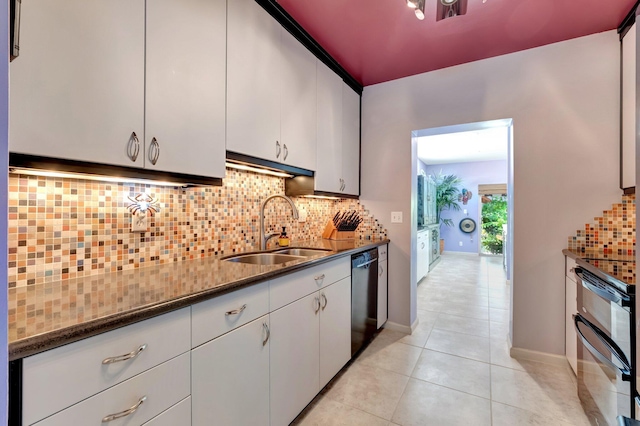110 Dolphin Rd, Ocean Ridge, FL 33435 - kitchen featuring a sink, dishwashing machine, white cabinets, and light tile patterned floors