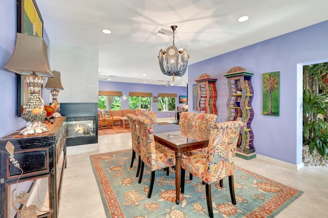 110 Dolphin Rd, Ocean Ridge, FL 33435 - dining room with a chandelier, a multi sided fireplace, recessed lighting, light tile patterned floors, and baseboards