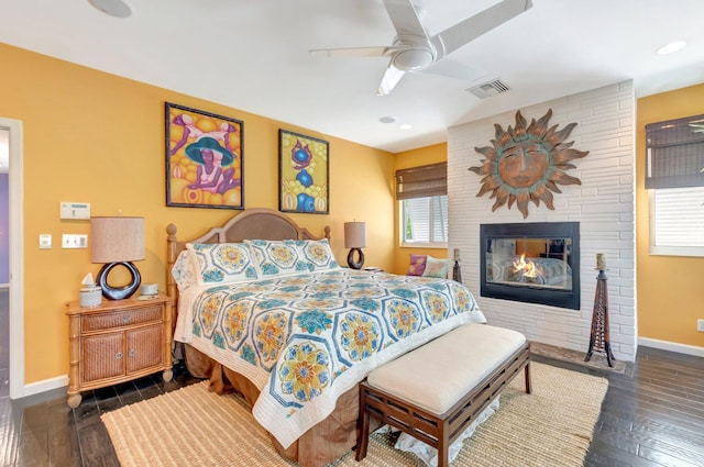 110 Dolphin Rd, Ocean Ridge, FL 33435 - bedroom featuring baseboards, dark wood-style floors, a fireplace, a ceiling fan, and recessed lighting