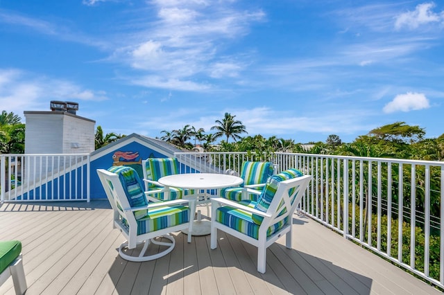 110 Dolphin Rd, Ocean Ridge, FL 33435 - wooden terrace with outdoor dining space
