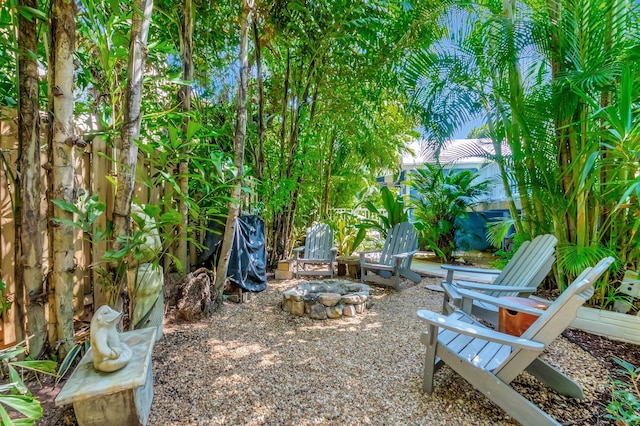 110 Dolphin Rd, Ocean Ridge, FL 33435 - view of yard featuring an outdoor fire pit