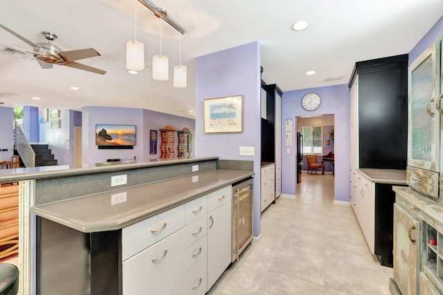 110 Dolphin Rd, Ocean Ridge, FL 33435 - kitchen with wine cooler, ceiling fan, white cabinets, light countertops, and recessed lighting