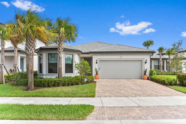doorway to property with stucco siding and a garage