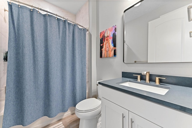 full bathroom featuring wood finished floors, toilet, vanity, and shower / bath combination with curtain