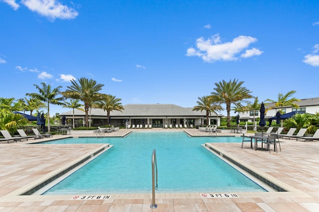 community pool with a patio area