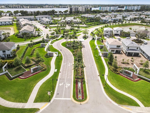 birds eye view of property with a residential view and a water view