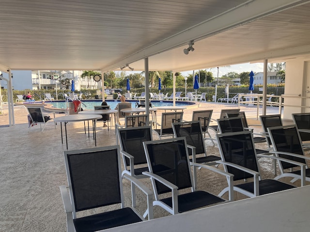 view of patio featuring a community pool