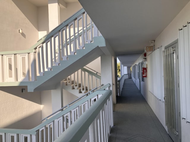 corridor featuring a high ceiling