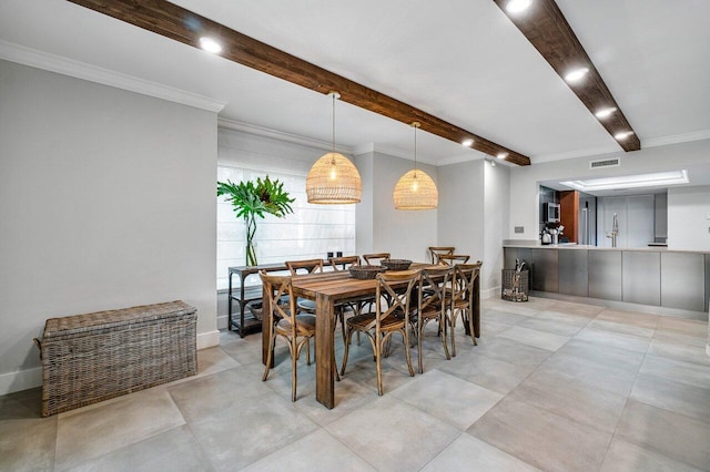 dining space featuring crown molding, beamed ceiling, and visible vents