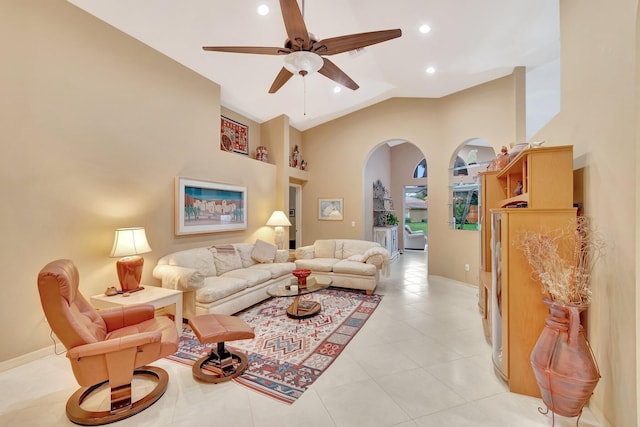 12589 Via Ravenna, Boynton Beach, FL 33436 - living area featuring high vaulted ceiling, a ceiling fan, arched walkways, light tile patterned floors, and baseboards