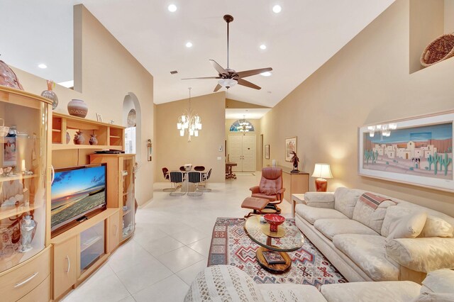 12589 Via Ravenna, Boynton Beach, FL 33436 - living room with high vaulted ceiling, ceiling fan with notable chandelier, recessed lighting, arched walkways, and light tile patterned floors