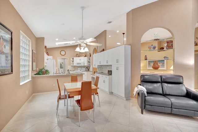 12589 Via Ravenna, Boynton Beach, FL 33436 - dining space featuring light tile patterned floors, a ceiling fan, and vaulted ceiling