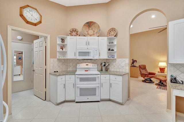12589 Via Ravenna, Boynton Beach, FL 33436 - kitchen featuring tasteful backsplash, white cabinets, white appliances, and open shelves