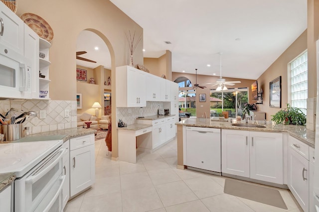 12589 Via Ravenna, Boynton Beach, FL 33436 - kitchen with a sink, white appliances, arched walkways, a peninsula, and ceiling fan
