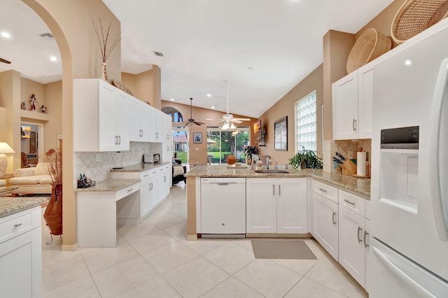 12589 Via Ravenna, Boynton Beach, FL 33436 - kitchen featuring white appliances, light stone countertops, a peninsula, ceiling fan, and white cabinetry