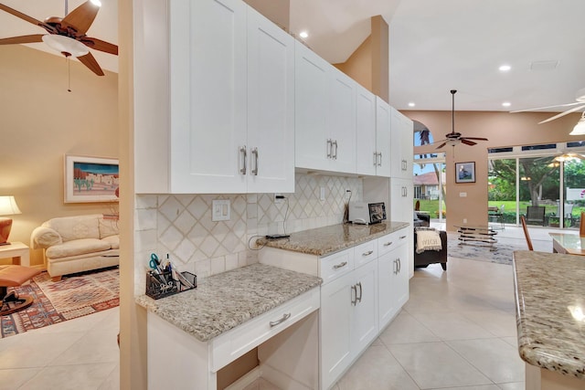 12589 Via Ravenna, Boynton Beach, FL 33436 - kitchen with light tile patterned floors, a ceiling fan, open floor plan, and backsplash