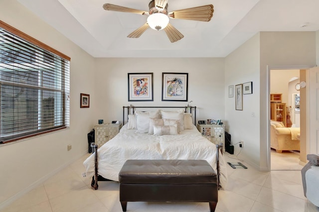 12589 Via Ravenna, Boynton Beach, FL 33436 - bedroom featuring baseboards, a tray ceiling, light tile patterned floors, arched walkways, and a ceiling fan