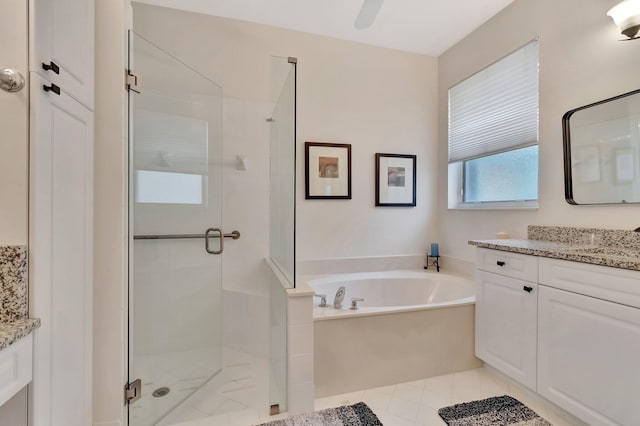 12589 Via Ravenna, Boynton Beach, FL 33436 - bathroom featuring tile patterned flooring, a stall shower, vanity, and a bath