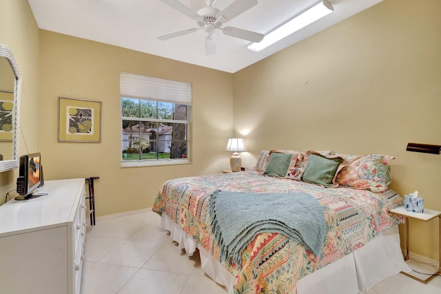 12589 Via Ravenna, Boynton Beach, FL 33436 - bedroom featuring light tile patterned flooring, ceiling fan, and baseboards