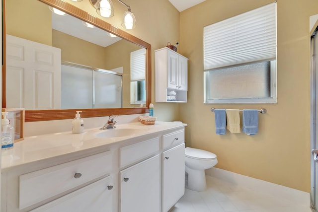 12589 Via Ravenna, Boynton Beach, FL 33436 - bathroom featuring vanity, toilet, a stall shower, and a wealth of natural light