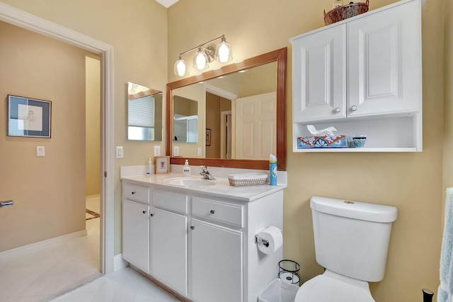 12589 Via Ravenna, Boynton Beach, FL 33436 - bathroom featuring toilet, vanity, and tile patterned flooring
