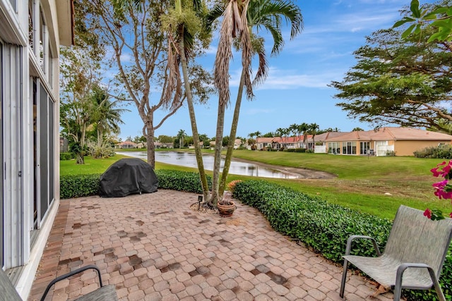 12589 Via Ravenna, Boynton Beach, FL 33436 - view of patio / terrace featuring area for grilling and a water view